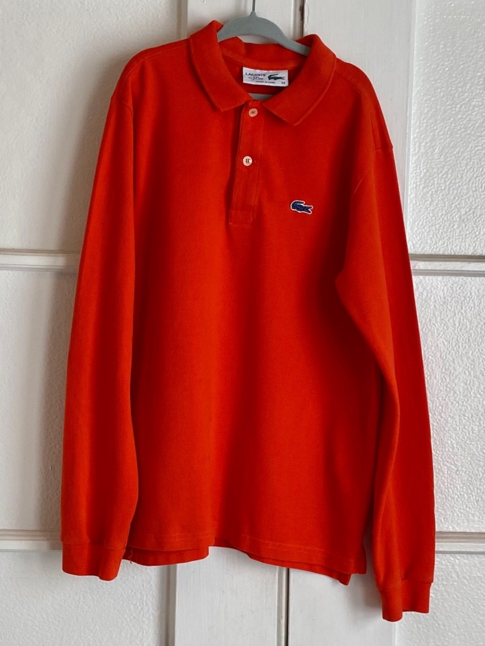 Boys Lacoste Orange polo shirt, size 12.